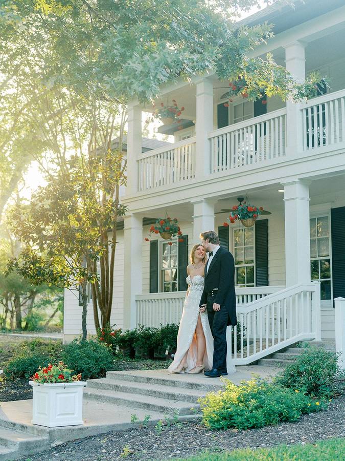 Couple on the front steps of The Manor at River Road Venue