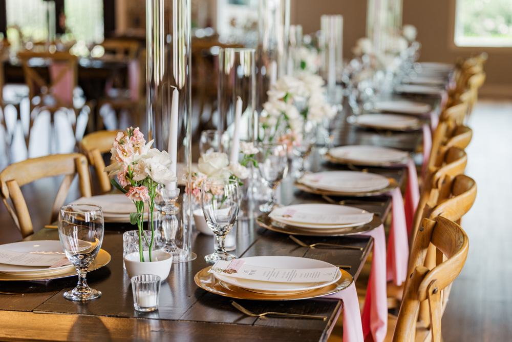 Farm tables set for dinner in the River Road reception hall